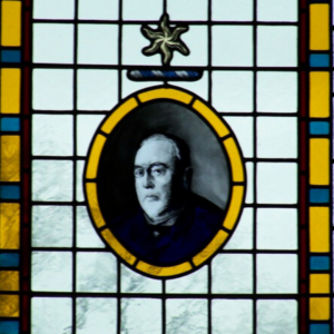 painted portrait in stained glass window