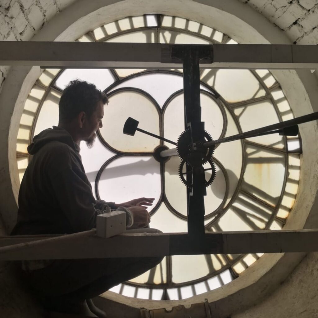 Francois vd Merwe inside a clock tower